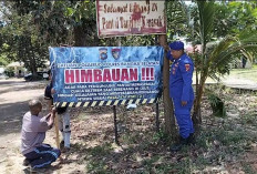 Satpolairud Polres Basel Pasang Spanduk Imbauan di Pantai Tanjung Kerasak